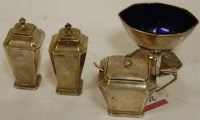 Lot 260 - An Art Deco silver three piece cruet, of...