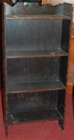 Lot 1061 - An oak freestanding open bookshelf; and two...