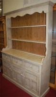 Lot 1084 - A modern cream painted pine Welsh dresser,...