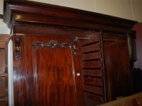 Lot 1136 - A Victorian mahogany triple wardrobe, having...