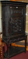 Lot 1150 - An antique low relief carved and joined oak...