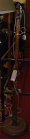 Lot 1152 - A walnut turned and reeded standard lamp