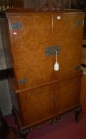 Lot 1162 - A reproduction figured walnut four door...