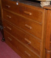 Lot 1165 - A 1950s oak chest of four long drawers