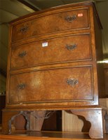 Lot 1171 - A burr walnut bowfront chest of three long...