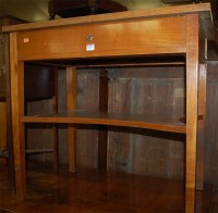 Lot 1176 - A circa 1900 birch single drawer two tier side...