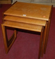 Lot 1185 - A 1970s G-Plan teak nest of three occasional...
