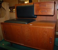 Lot 1195 - A 1970s teak and black vinyl telephone seat,...