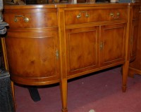 Lot 1207 - A reproduction yew wood bowfront sideboard