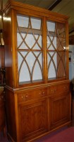 Lot 1208 - A reproduction yew wood bookcase cupboard,...