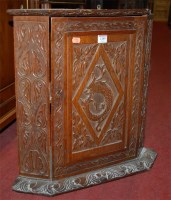 Lot 1209 - A 19th century low relief carved oak single...