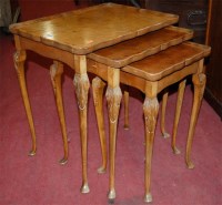 Lot 1218 - A reproduction figured walnut nest of three...