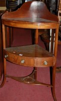 Lot 1243 - An early 19th century mahogany three-tier...