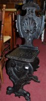 Lot 1246 - A Continental low relief carved and ebonised...
