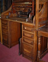 Lot 1251 - An early 20th century oak roll-top twin...
