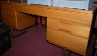 Lot 1260 - A 1970s Uniflex teak kneehole mirrorback...