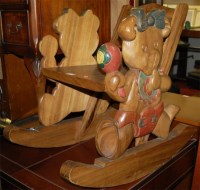 Lot 1264 - A modern Eastern teak childs rocking chair