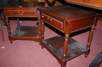 Lot 1266 - A pair of mahogany two-tier single drawer low...