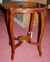 Lot 1268 - An Edwardian walnut piecrust topped two-tier...