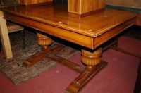 Lot 1271 - A moulded oak drawer leaf dining table