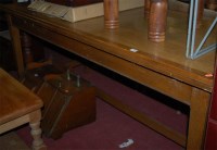 Lot 1305 - An early 20th century oak dining table of...