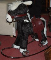 Lot 1308 - A modern child's upholstered rocking horse on...