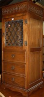 Lot 1319 - A moulded oak and lead glazed freestanding...