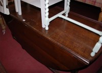 Lot 1326 - An antique joined oak dropleaf dining table of...