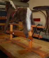 Lot 1327 - A Pegasus of Crewe child's upholstered rocking...