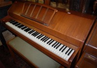 Lot 1333 - A 1970s Eavestaff teak upright piano, iron...