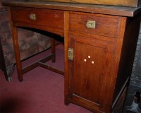Lot 1340 - An Arts & Crafts oak and green hide inset...