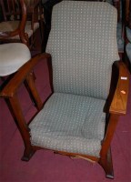 Lot 1355 - A 1930s oak and upholstered open armchair
