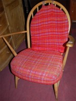 Lot 1373 - An Ercol blond elm stickback low armchair;...
