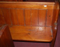 Lot 1380 - A late Victorian stained pine church pew, of...