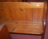 Lot 1381 - A late Victorian stained pine church pew, of...
