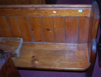 Lot 1382 - A late Victorian stained pine church pew, of...