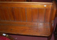 Lot 1383 - A late Victorian stained pine church pew, of...
