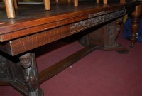 Lot 1297 - A large Continental carved oak drawer leaf...
