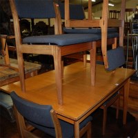Lot 1296 - A 1960s teak dining suite comprising;...