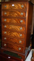 Lot 1390 - A reproduction flame mahogany music chest of...