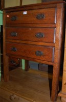 Lot 1399 - A circa 1900 oak chest of three long drawers