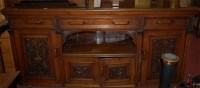 Lot 1410 - An Edwardian low relief carved walnut dresser...