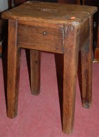 Lot 1417 - A rustic 19th century elm milking stool