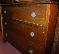 Lot 1420 - An Edwardian walnut ledgeback chest of three...