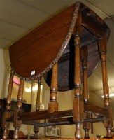 Lot 1421 - An early 20th century oak dropleaf gateleg...