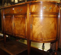 Lot 1422 - A reproduction mahogany bowfront side cabinet,...