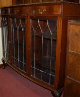 Lot 1427 - A 1930s mahogany bowfront three drawer glazed...