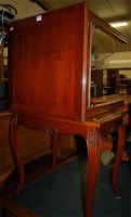 Lot 1292 - A reproduction hardwood low occasional table,...