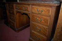 Lot 1439 - An Edwardian walnut kneehole writing desk,...