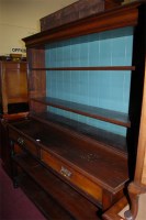 Lot 1442 - An Edwardian walnut dresser, the open two-tier...